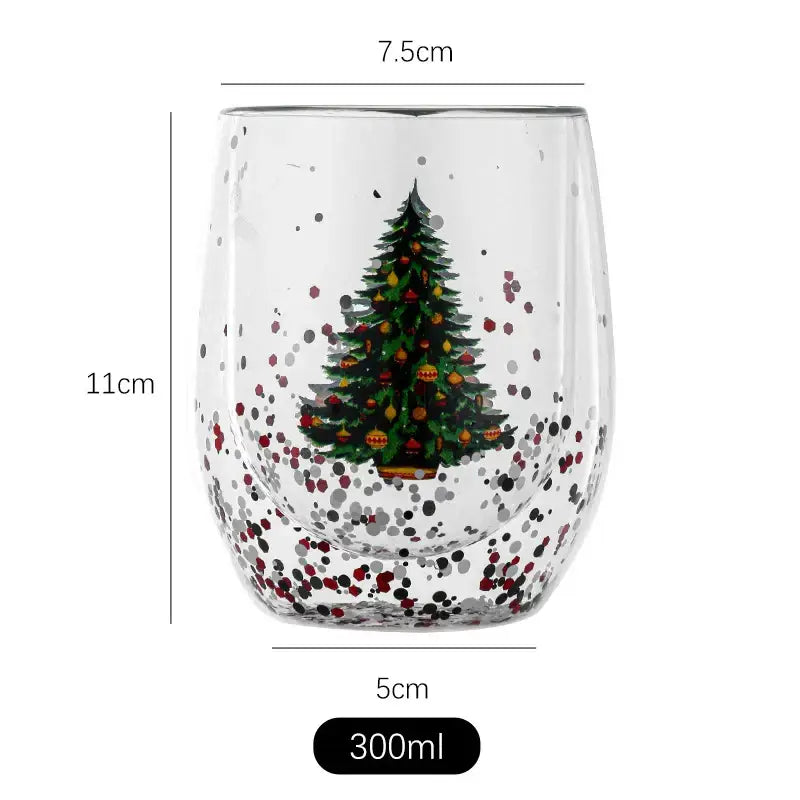 A clear double wall glass mug with a festive christmas tree design and colorful ornament accents for kitchen decor
