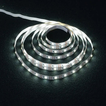 Coiled white flexible usb led light strips with bright evenly spaced bulbs and adhesive backing for tv bedroom lighting