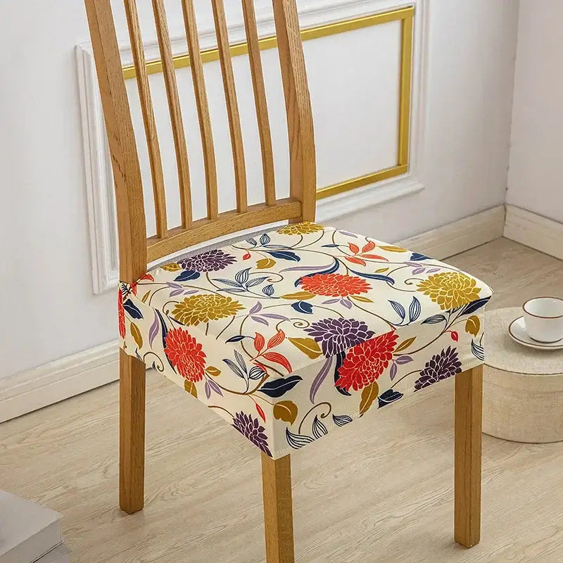 Floral blue and green elastic print chair cover with vibrant cream red yellow and purple floral pattern in stretchy fabric
