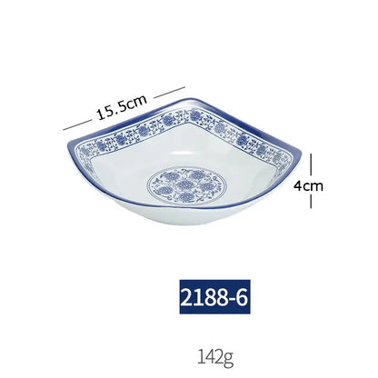 A white imitation porcelain dish with blue floral patterns measuring 15.5cm wide from a floral blue and white dinner set