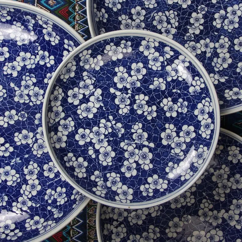 Blue and white porcelain serving plate with delicate floral pattern and crackled glaze for dining room tableware