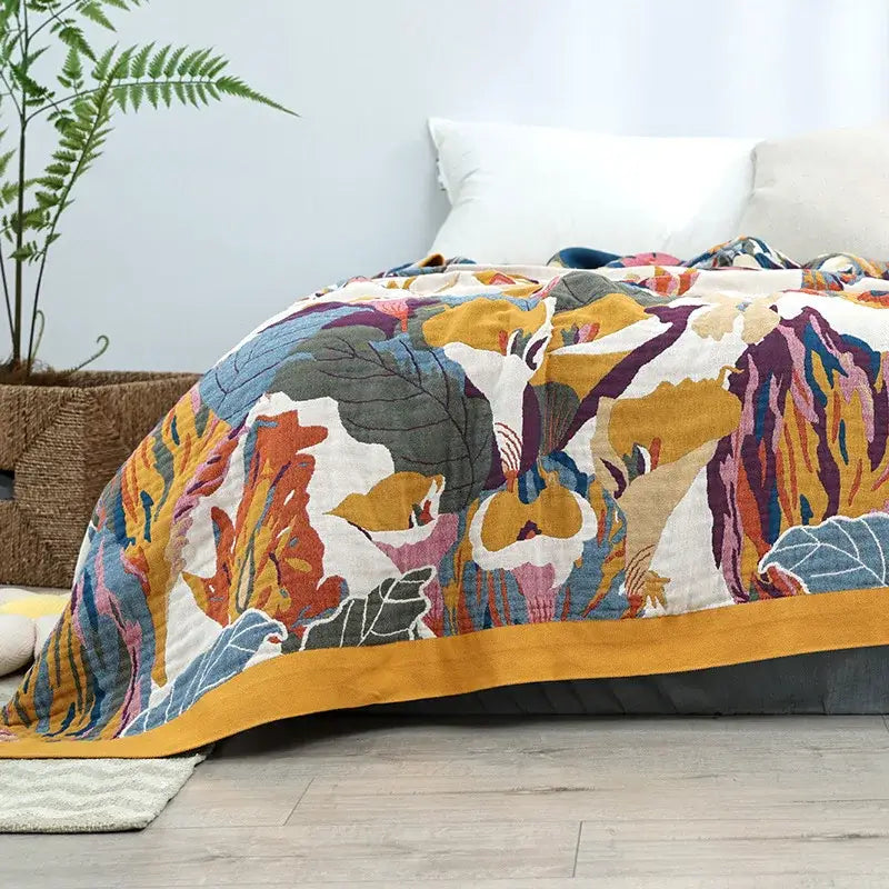 Vibrant decorbites cotton summer blanket featuring hand-quilted botanical print in mustard yellow purple teal hues
