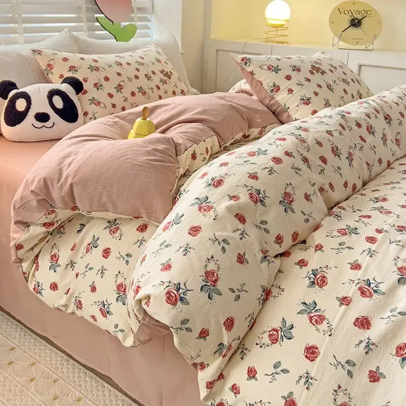 Floral cream and peach double layer cotton quilt cover set with soft cream base, red roses, and cozy pink duvet cover