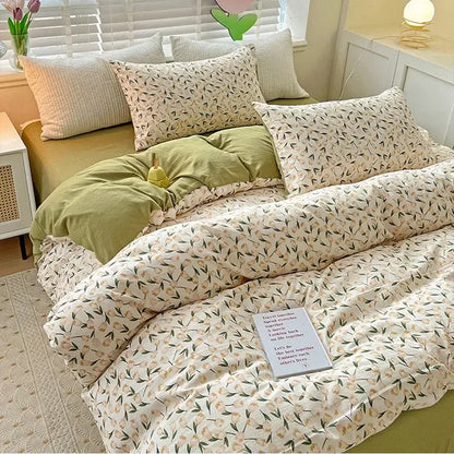 Cream-colored cotton quilt cover set with delicate floral peach and green pattern with matching pillowcases