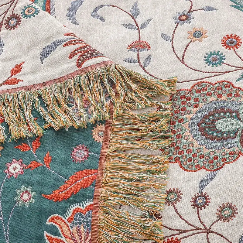 Floral cream jacquard cotton gauze sofa cover with hand-embroidered teal coral blue floral pattern and multicolored fringe