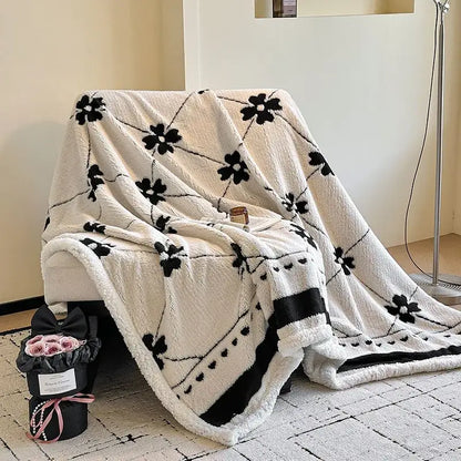 Cream-colored jacquard lamb wool blanket with black floral and heart patterns soft textured living room throw
