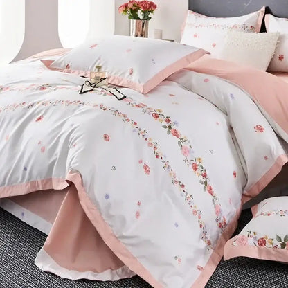 Pastel pink and white floral printed egyptian cotton bedding set with delicate embroidery and satin trim details