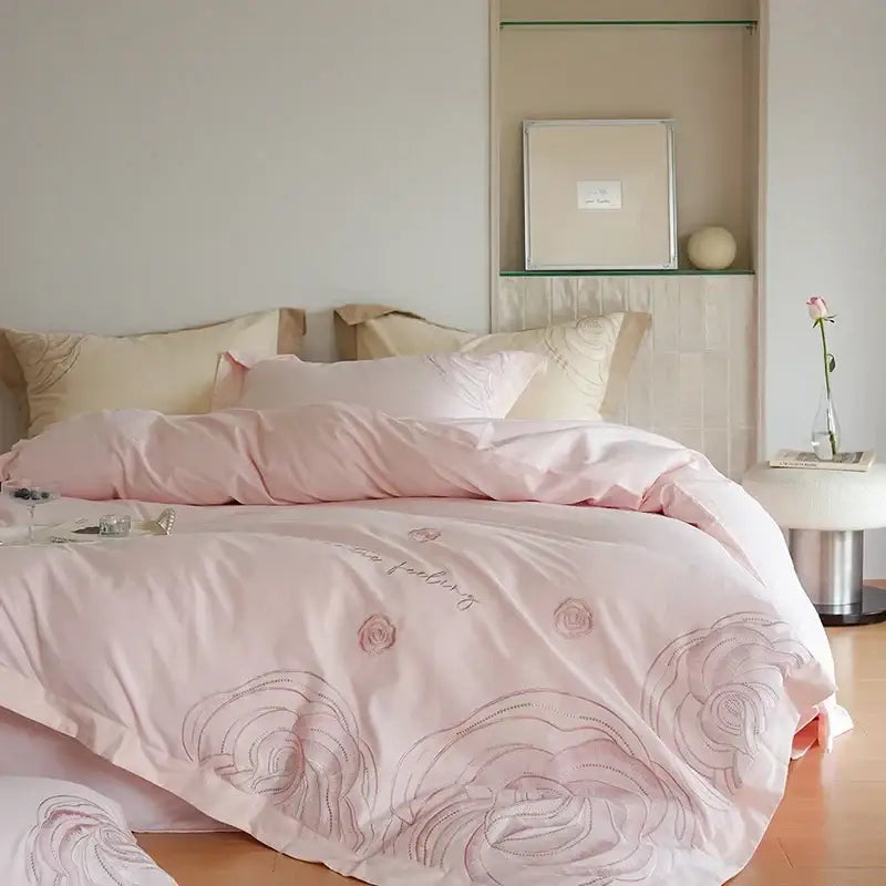 Pink satin duvet cover set with embroidered rose patterns and love feeling script for elegant bedroom decor