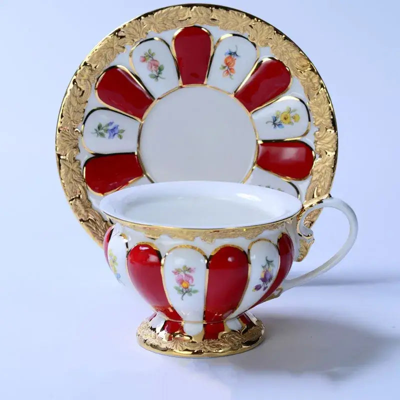Elegant red and white porcelain tea cup saucer set with gold trim and floral motifs for dining room drinkware