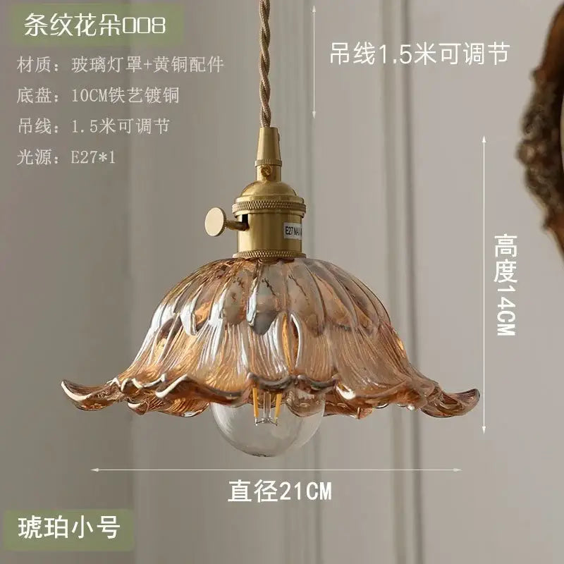 Floral green and champagne glass pendant light with amber petal design brass hardware and adjustable cord for dining room