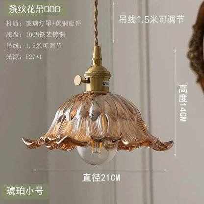 Floral green and champagne glass pendant light with amber petal design brass hardware and adjustable cord for dining room