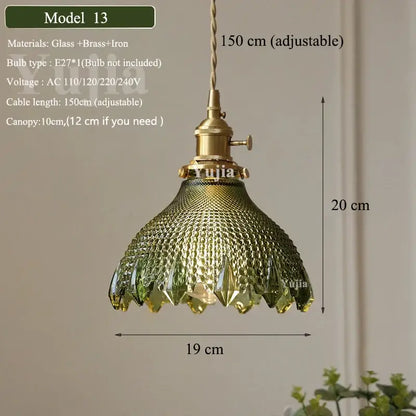 Floral green glass and brass pendant light with textured green glass shade and iron hardware for kitchen use