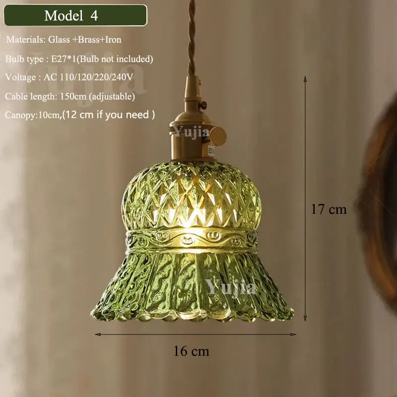 Vintage-style pendant light featuring a green glass shade with diamond-cut patterns and a brass-finished fixture