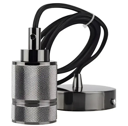 Industrial-style black and silver pendant light with textured metal body and braided cable complements floral green glass pendant lights