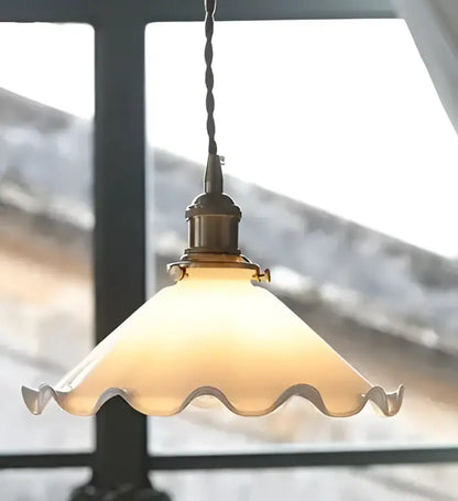 Antique brass-finished pendant light with warm frosted scalloped glass shade for dining room glass pendant lights