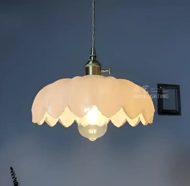 Floral green glass pendant light with soft peach scalloped glass shade and golden brass hardware for living room