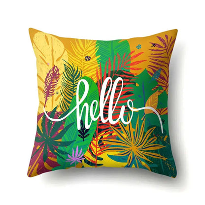 Vibrant green tropical leaves pillow cover with bold foliage and white hello script for decorbites green tropical decor