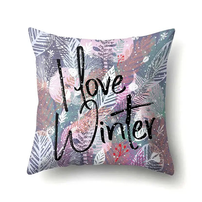 A square pillow cover with colorful purple, pink, teal, and gray green tropical leaves and snowflakes decorbites green tropical design
