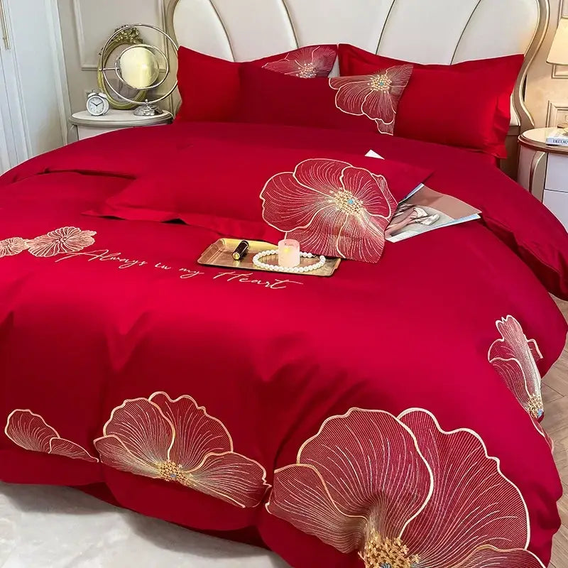 Red satin duvet cover with embroidered gold floral patterns and always in my heart stitching in an embroidered egyptian cotton bedding set