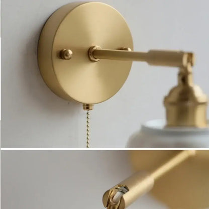 Gold-finished adjustable wall light fixture with sleek minimalist design and pull chain for bedroom use