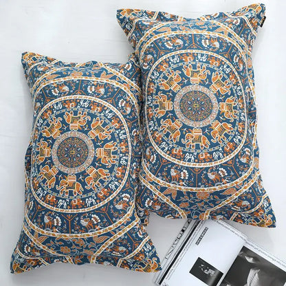 Blue and orange mandala-patterned pillowcases with intricate elephant designs complement decorbites cotton picnic blanket bedspread