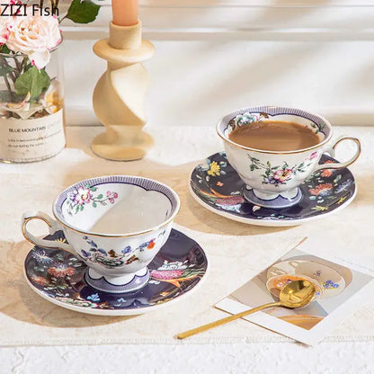 Elegant ceramic cup and saucer set with decorbites flowers pattern in soft pastels and gold trim on navy background
