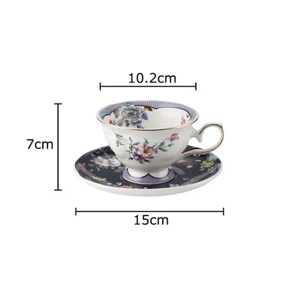 A porcelain ceramic cup and saucer set with decorbites flowers pattern in soft pastels and gold-trimmed rims