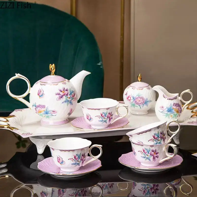 Elegant porcelain coffee mug set with delicate pink and purple floral patterns and gold-trimmed handles and lids