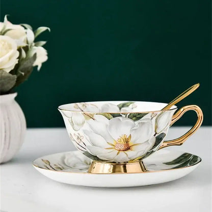 Elegant white porcelain tea cup set with gold trim and delicate magnolia flower design for dining room use