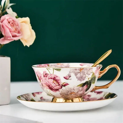 Elegant porcelain tea cup set with pink and purple floral design and gold trim for dining room coffeeware