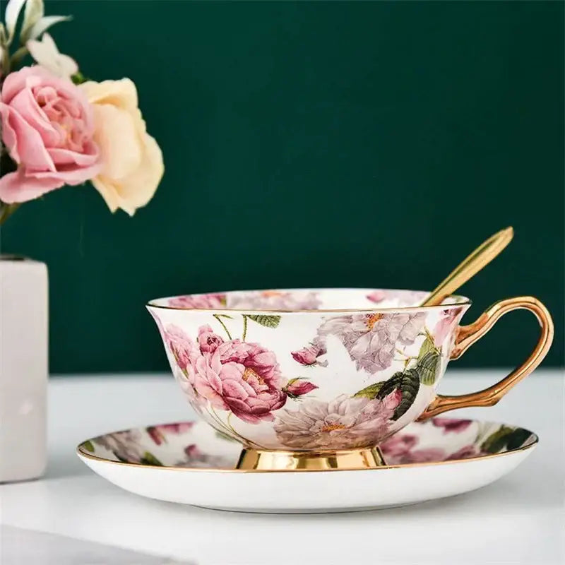 Elegant porcelain tea cup set with pink and purple floral design and gold trim for dining room coffeeware