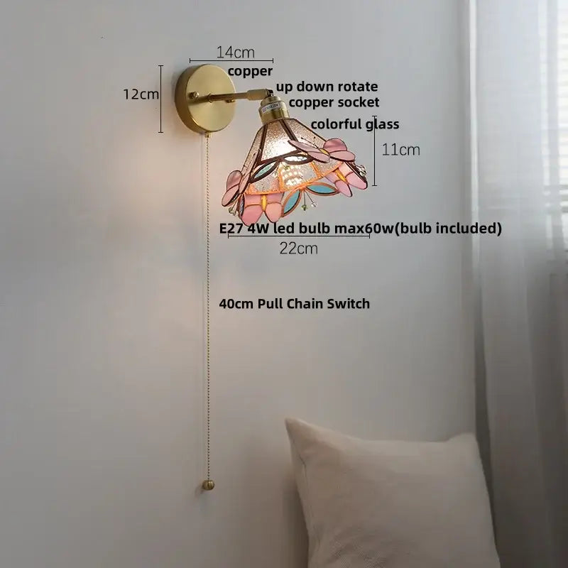 A floral pink and teal decorbites butterfly glass wall light with copper-finished base and rotating socket for bedroom