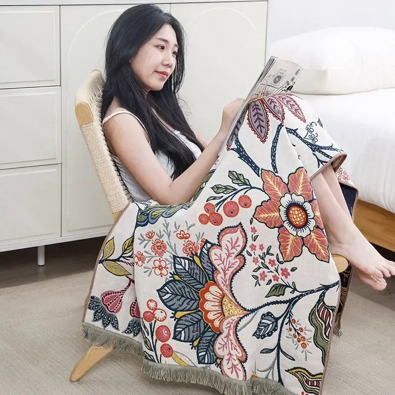 A cozy cream-colored decorbites cotton gauze bath towel with vibrant floral pattern for bathroom decor