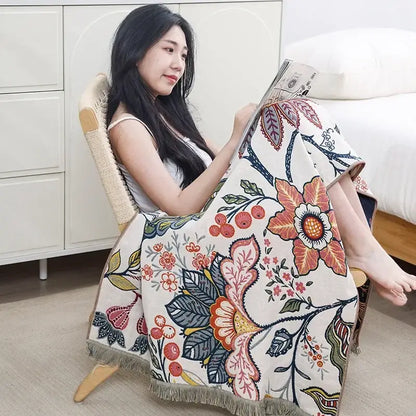 A cozy cream-colored decorbites cotton gauze bath towel with vibrant floral pattern for bathroom decor