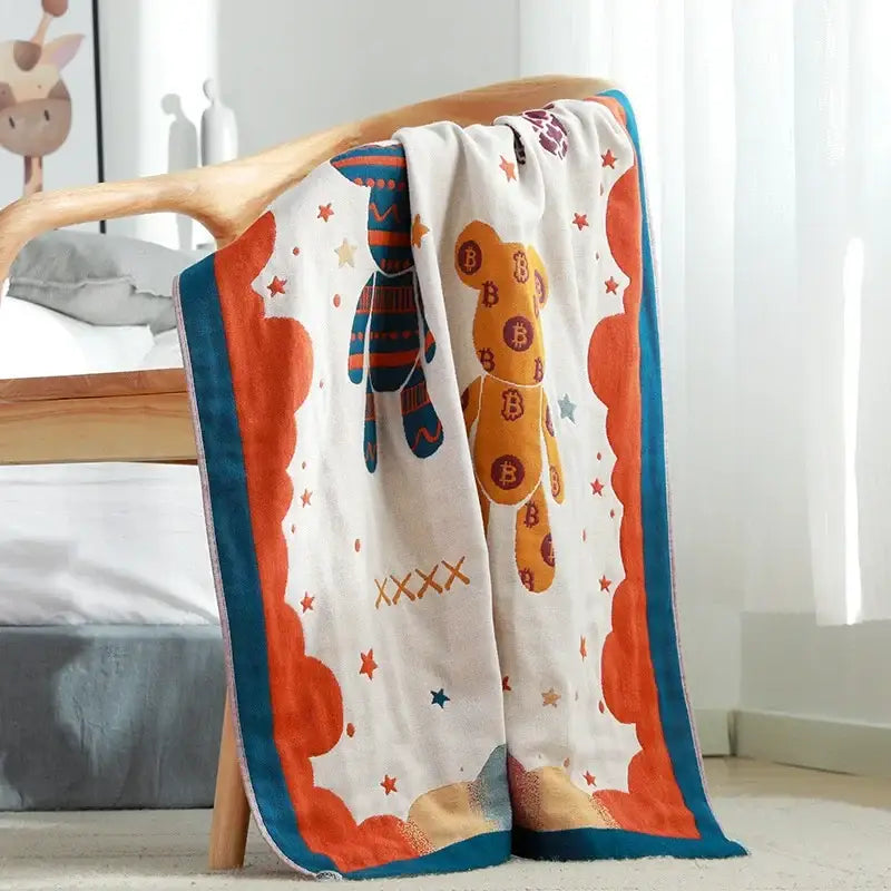 Floral pink and yellow cotton gauze bath towel featuring a playful bear design with orange and teal trim decorbites cotton gauze