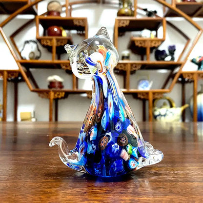 A translucent blue and clear cute cat glass figurine with intricate colorful patterns for living room decor
