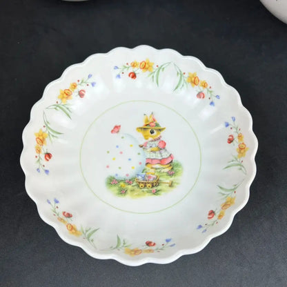 White ceramic easter tulip dinnerware set plate with bunny in yellow hat pink dress and floral borders