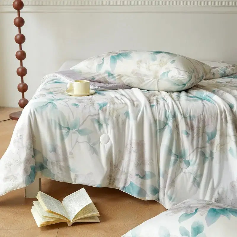 A soft white duvet cover with a teal and pale gray floral pattern in decorbites knitted cotton print summer quilt style