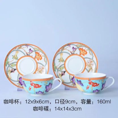 A delicate porcelain bone dinnerware set coffee cup and saucer with vibrant floral pattern on light blue background