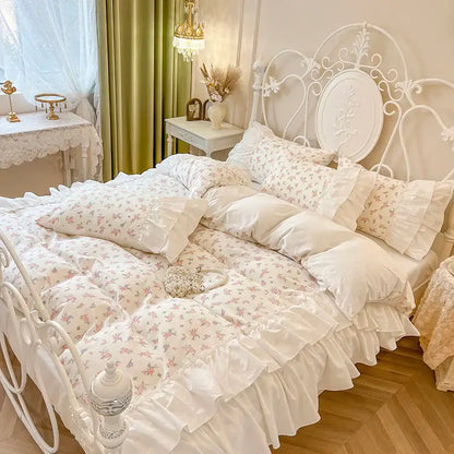 White floral cotton bedding set with satin-like fabric and delicate pink blossoms featuring pleat lace ruffles