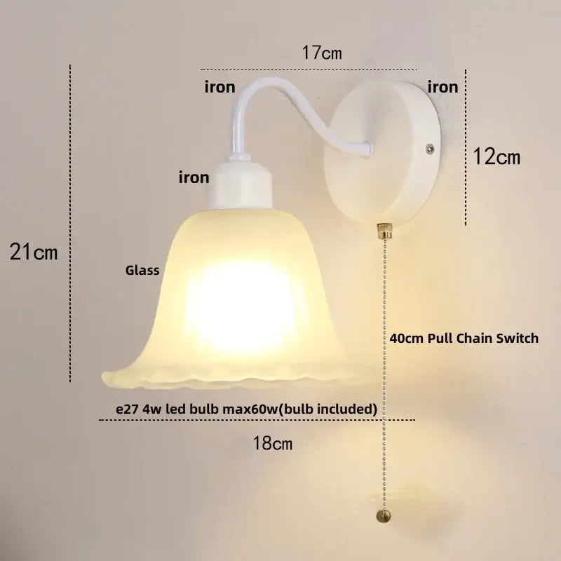 White iron wall sconce with frosted glass bell-shaped shade and 40cm pull chain switch for stair light use