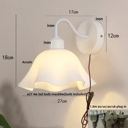 Floral white glass wall sconce with white iron frame and soft acrylic lampshade featuring a pull chain switch