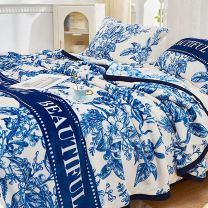 Floral white and navy cozy flannel plush blanket with blue and white floral pattern and beautiful text edge decorbites cozy flannel