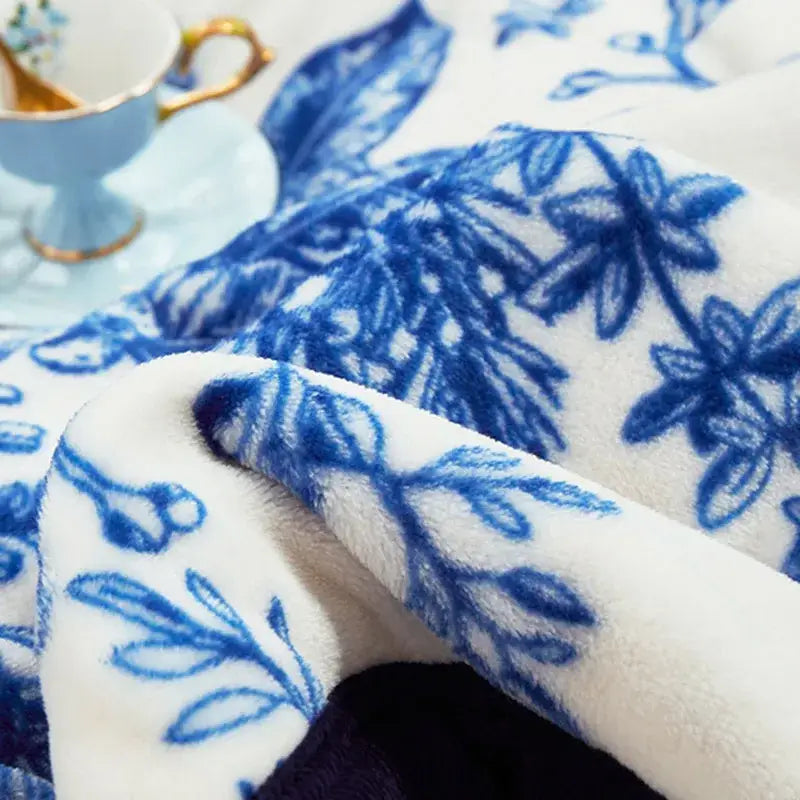 Floral white and navy cozy flannel plush blanket featuring a blue porcelain floral pattern for bedroom decorbites cozy flannel throw