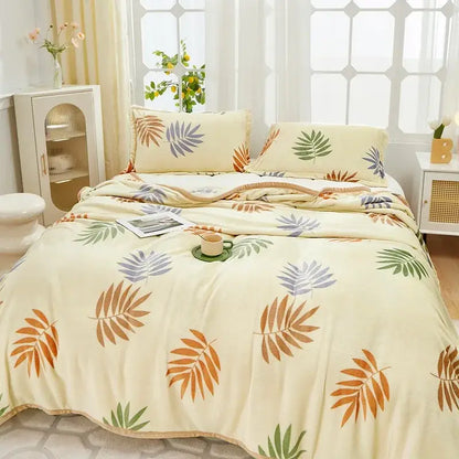 Cream-colored cozy flannel plush blanket with tropical leaf pattern in orange green and purple for bedroom decorbites cozy flannel