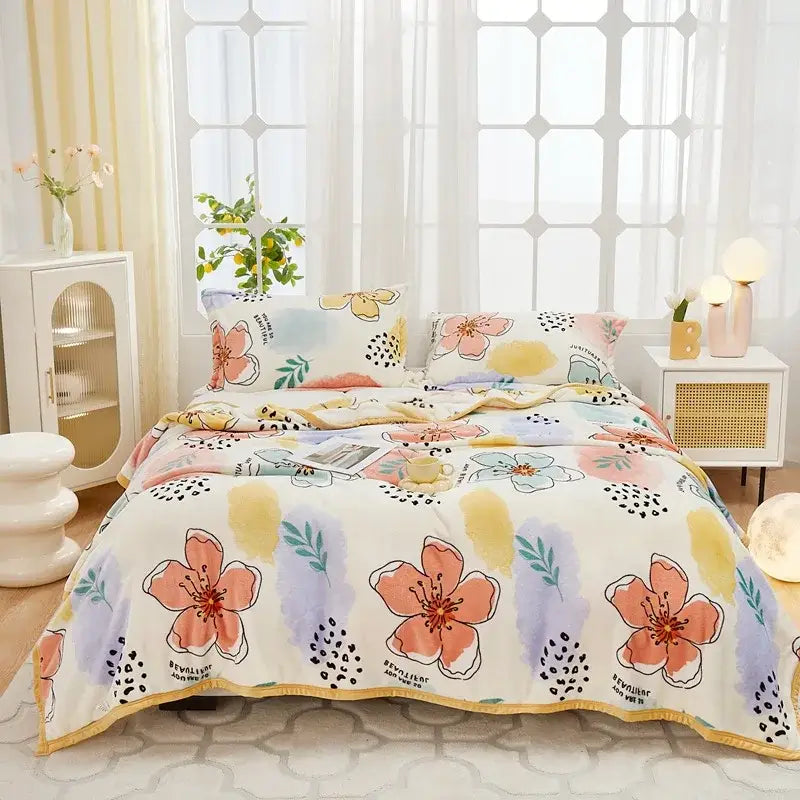 Pastel floral comforter set with peach and lavender blossoms on cream background paired with decorbites cozy flannel plush blanket
