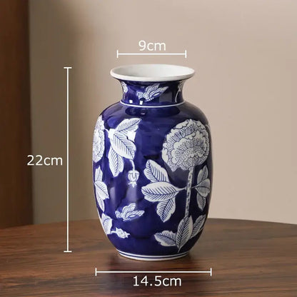 Classic blue and white porcelain vase with intricate floral patterns and glossy finish for living room decor
