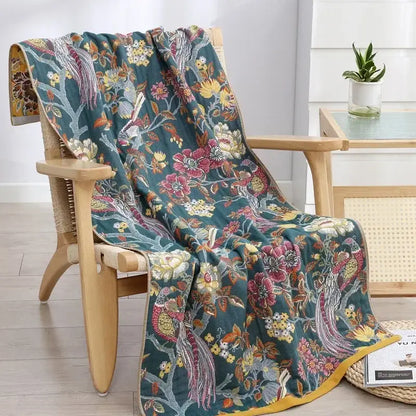 Teal floral cotton gauze bath towel with vibrant bird and flower patterns and yellow border from decorbites quick dry wrap