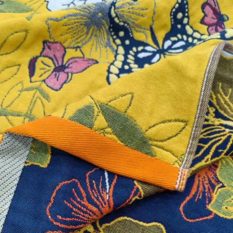 Vibrant yellow cotton gauze floral bath towel with embroidered pink navy blue and green butterflies for quick dry wrap