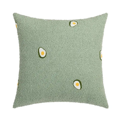 A soft light green decorbites fluffy comfort pillow cover with embroidered avocado design for living room decor